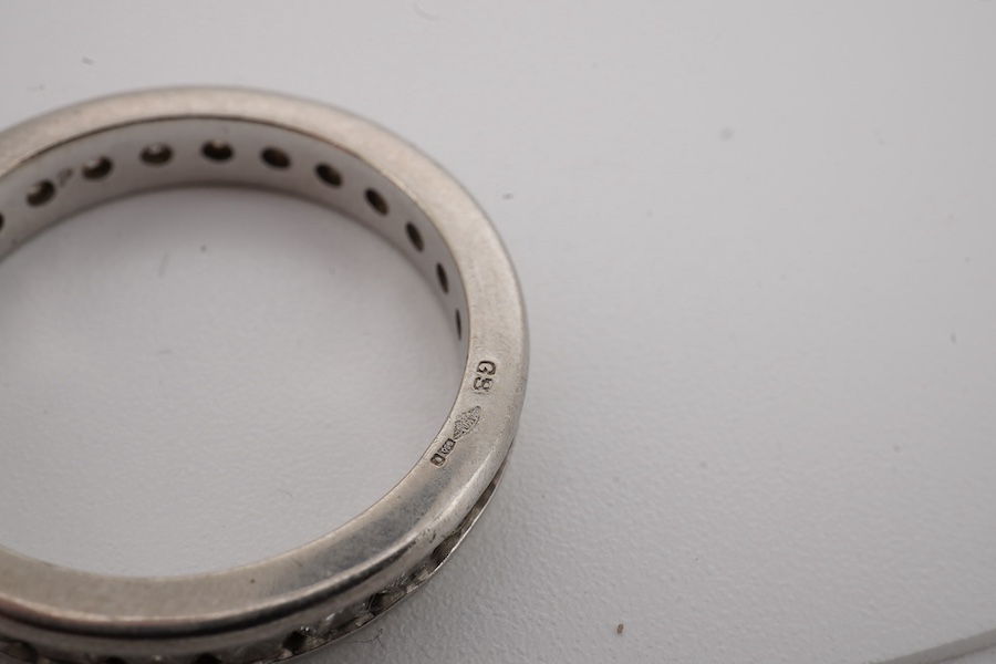 A diamond eternity ring, channel-set with a continuous band of brilliant-cut diamonds totalling approximately 1.20 carats, mounted in platinum, size P1/2, British hallmarks, Condition: good